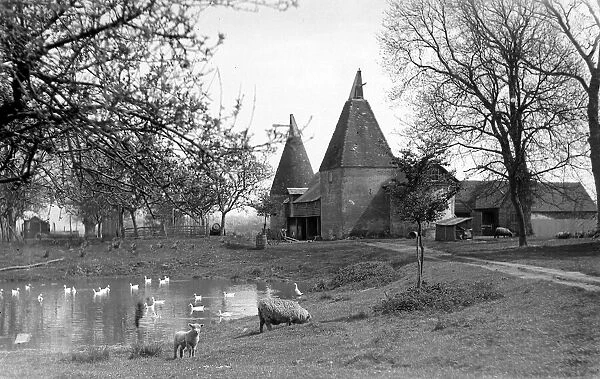 General view of a farm near Ashford in Kent, April 1932 Oast Houses