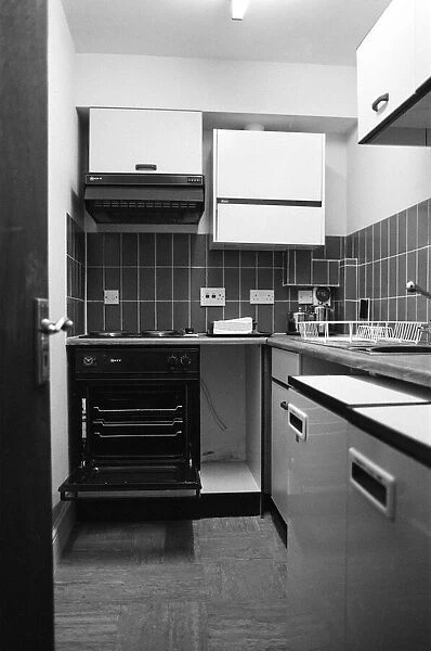 General view of a kitchen in a flat. 29th October 1986
