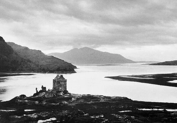 General view showing Eliean Donan Castle and Loch Duich with the hills of Skye in