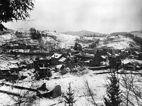 General view showing snow covered Houffaliz, severley damaged by shells and bombs