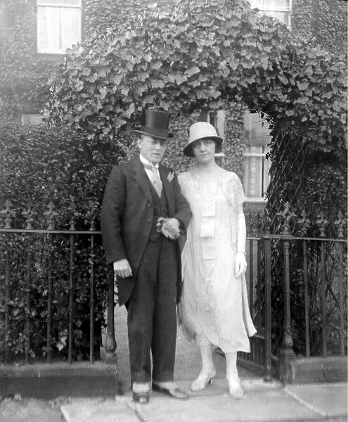 A gentleman and lady ready for a wedding. c. 1925