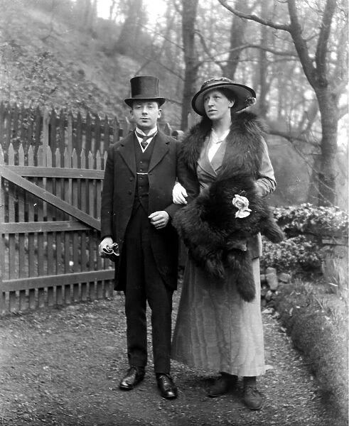 A gentleman and lady ready for a wedding. circa 1925