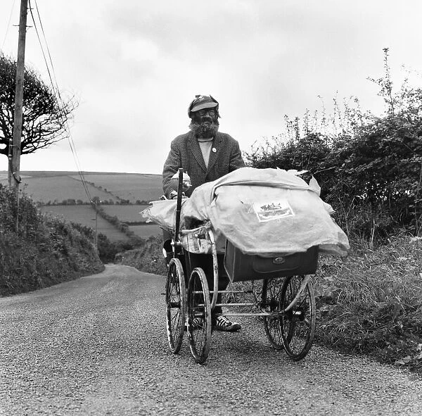 Gentleman of the road George Gibb seen here with his battered pram tramping the roads