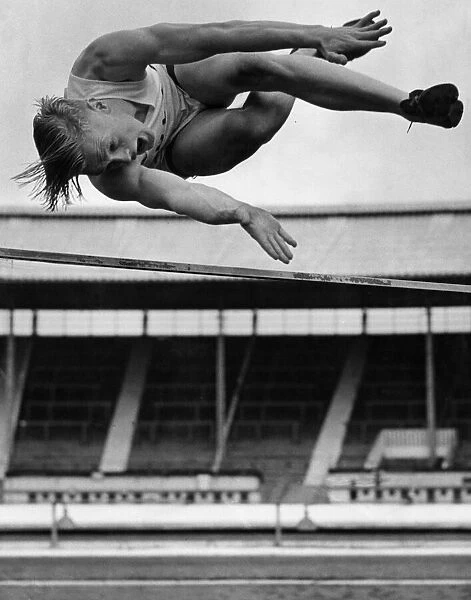 Geoff Elliot seen here competing and winning the high jump at the universities athletic