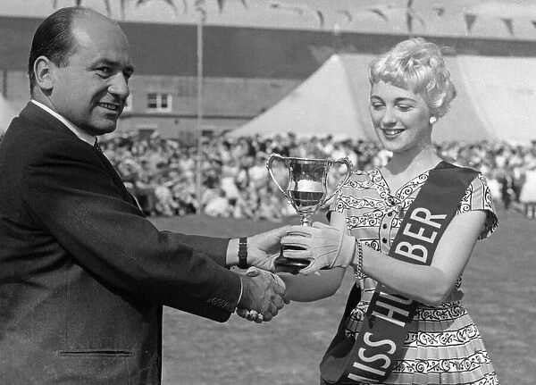 Geoffrey Rootes presenting a sash and cup to Mrs Greenway who was chosen as Miss Humber