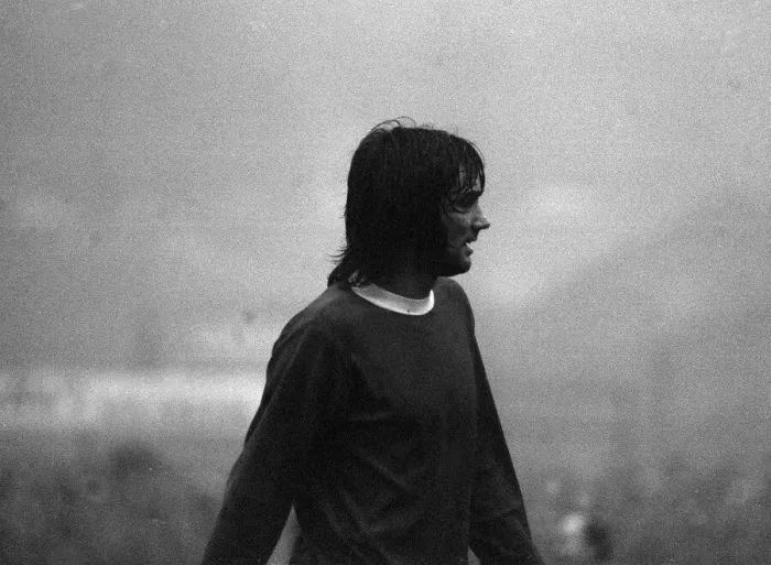 Framed Print : George Best appears out of the mist in the Huddersfield v Manchester United game on a