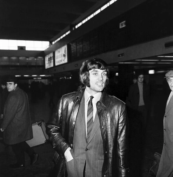George Best arrives at Euston Station with members of Manchester United Football team for