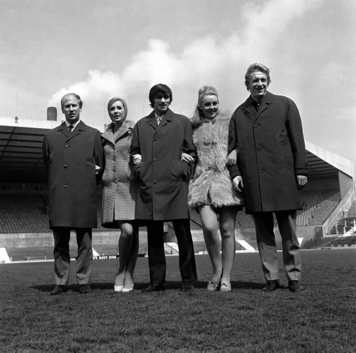 Framed Print : George Best centre with Bobby Charlton and Denis Law 1967 pose with two models at Old Framed Print : George Best centre with Bobby Charlton and Denis Law 1967 pose with two models at Old
