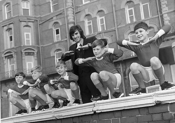 George Best with children from a Manchester children