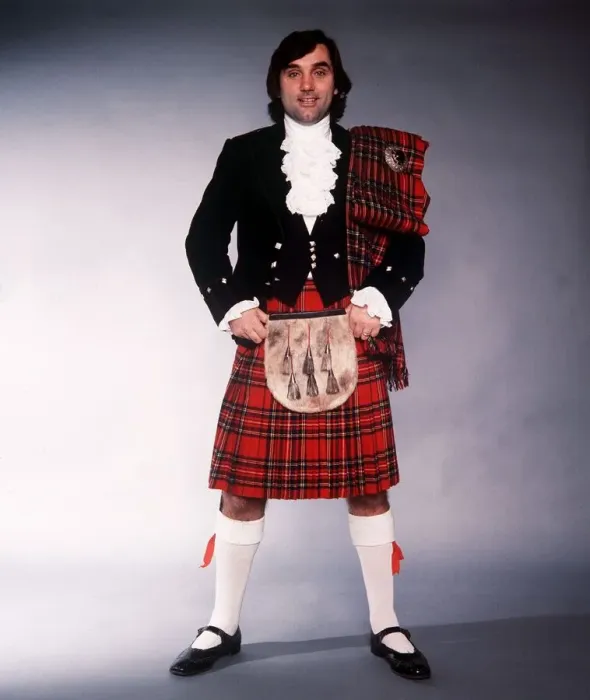 Framed Print : George Best football player dressed in traditional Scottish dress 1980