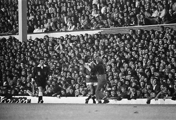 George Best is greeted by a fan during the match. Manchester United v Arsenal