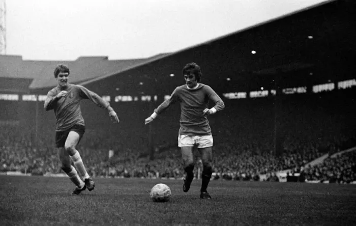 Framed Print : George Best of Manchester United on the ball watched by an Ipswich Town defender during Framed Print : George Best of Manchester United on the ball watched by an Ipswich Town defender during