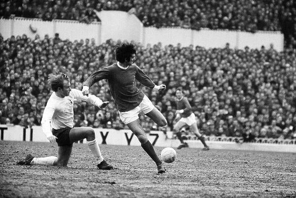 George Best of Manchester United back heels the ball to a team mate as Phil Beal of