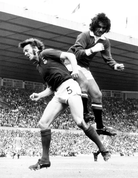 Framed Print : George Best of Manchester United jumps for the ball Aug 1972 against Alan Hunter of Framed Print : George Best of Manchester United jumps for the ball Aug 1972 against Alan Hunter of
