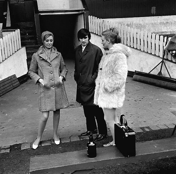George Best of Manchester United with two models 1964 at Old Trafford for fashion
