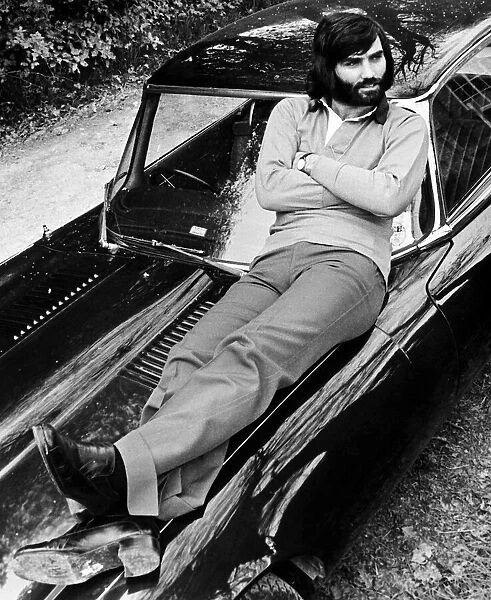 George Best relaxes on car after a drive in the country May 1974 D. Hutchinson