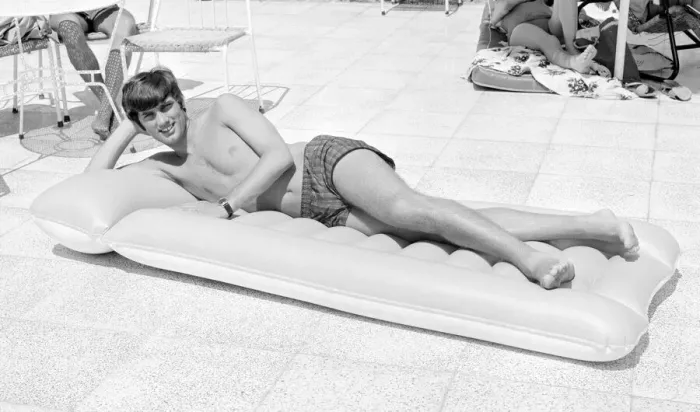 Framed Print : George Best relaxing on an inflatable bed whilst on holiday April 1967 Framed Print : George Best relaxing on an inflatable bed whilst on holiday April 1967
