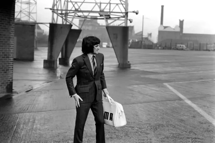 Framed Print : George Best right as he left Old Trafford ground to board the coach on route to Ipswich