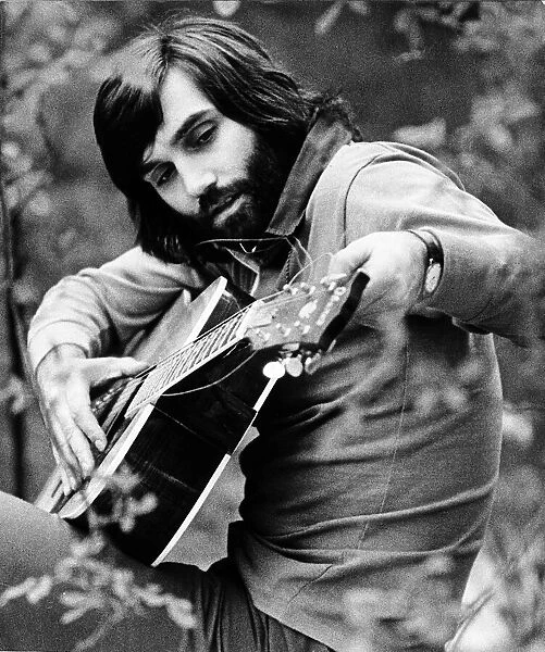 George Best seen here tuning his guitar May 1974
