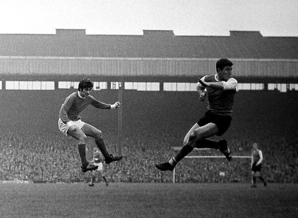 George Best shoots at goal for Manchester United past Sheffield Wednesday defender Johnny