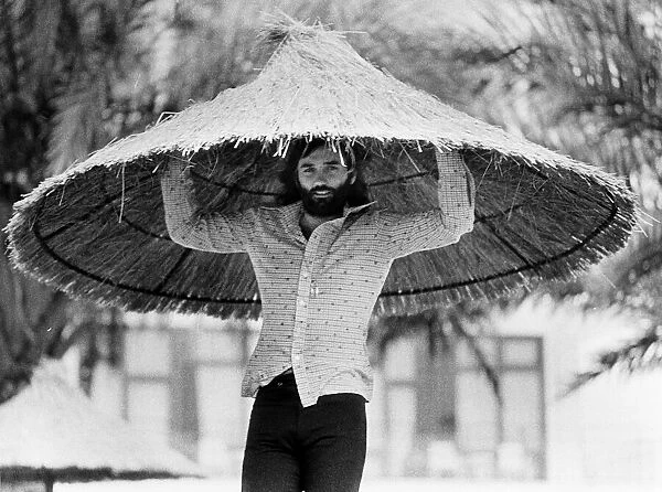 George Best with a over sized straw hat Circa 1974