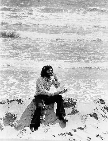 George Best alone with his thoughts on a deserted spanish beach Circa 1974
