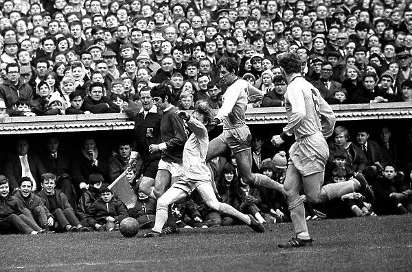 George Best on the wing for Manchester United challenged by three defenders during