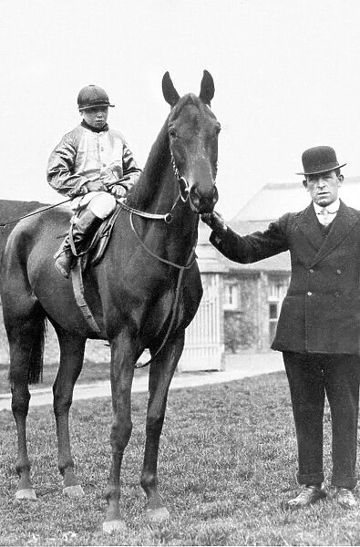 George Formby aged 10 on his fathers horse Eliza seen here with trainer Mr Schofield