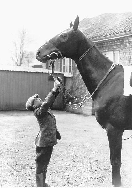 George Formby aged 10 years old 1915 reaches horses reins wears flat cap