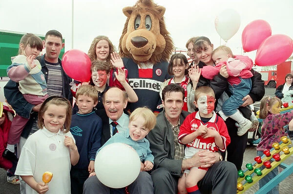 George Hardwick, Bernie Slaven and Roary the Boro mascot surrounded by fans at