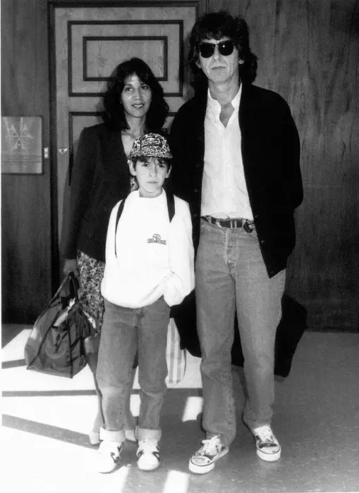 Framed Print : George Harrison formerly of the Beatles with family at London Airport August 1989