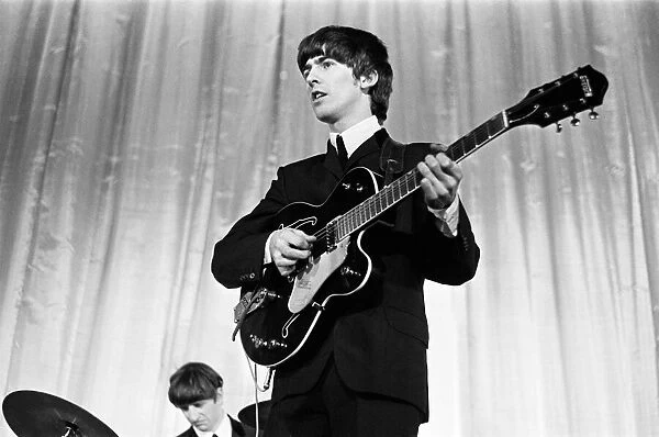 George Harrison of the Beatles seen here on stage November 1964