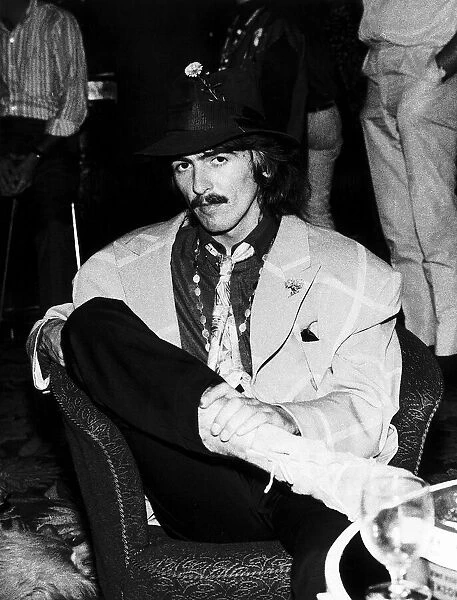 George Harrison of the Beatles sitting in a chair in the Atlantic Hotel in Newquay where