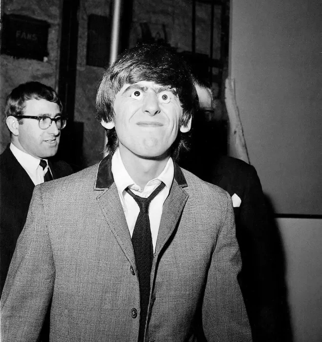 Framed Print : George Harrison with glass eyes when the Beatles details were being taken for their Framed Print : George Harrison with glass eyes when the Beatles details were being taken for their