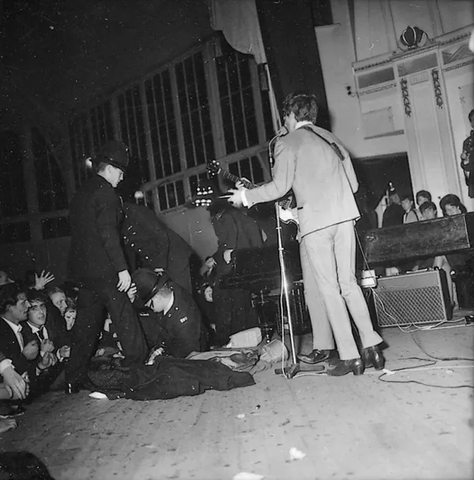 Framed Print : George Harrison and Paul McCartney performing onstage during the Beatles
