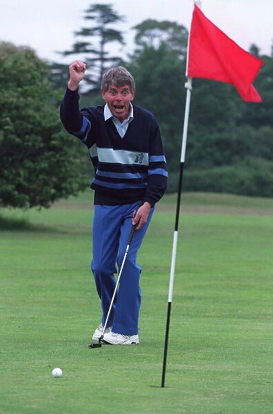 George King celebrates his scratchcard jackpot on the golfcourse after he