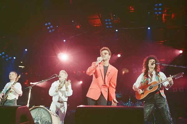 George Michael and the 3 remaining members of Queen perform the song '39'