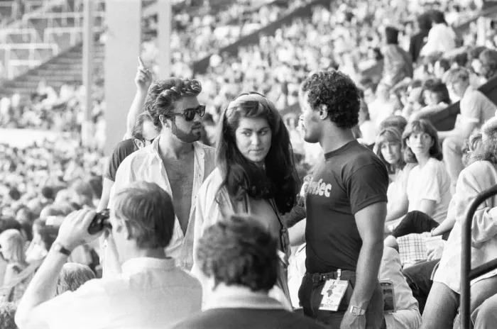 Framed Print : George Michael in the audience during the opening of the Live Aid Concert at Wembley Framed Print : George Michael in the audience during the opening of the Live Aid Concert at Wembley