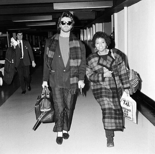 George Michael of the pop group Wham!, and girlfriend Pat Fernandez leaving Heathrow for