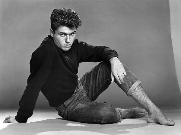 George Michael of the teenage duo Wham!, poses in the studio. 30th October 1982