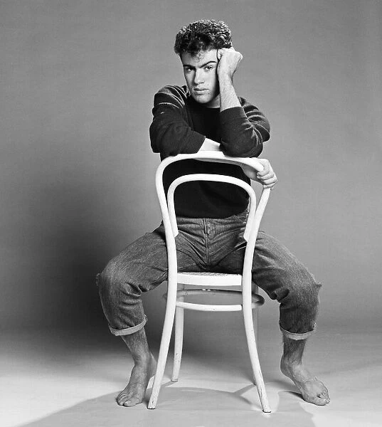 George Michael of the teenage pop duo Wham!, poses in the studio. 26th October 1982