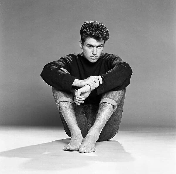 George Michael of the teenage pop duo Wham!, poses in the studio. 26th October 1982