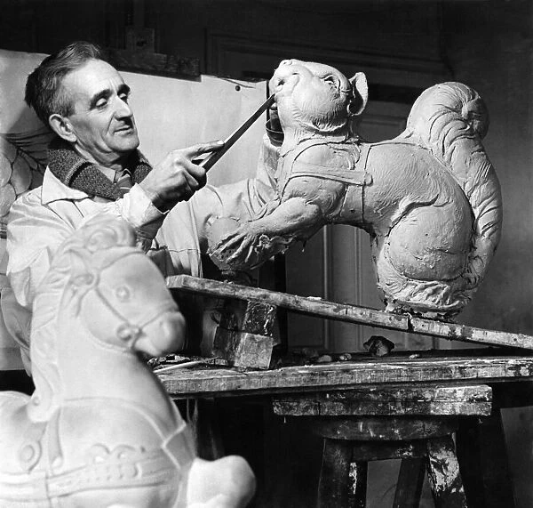 George Morwood the sculptor working on a model. March 1947 P004768