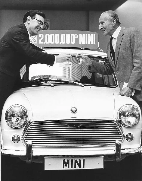 George Turnball left and Sir Alec Issigonis celebrating the 2, 000
