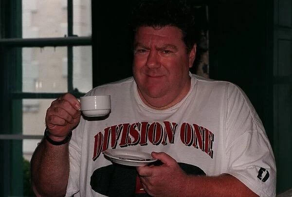 George Wendt Actor August 98 Who stared in Cheers holding a cup