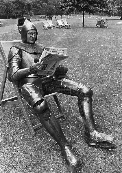 George young sunbathing in Green Park in a suit of Armour. August 1967 P014994
