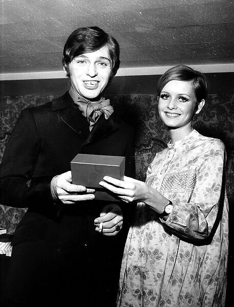 Georgie Fame is presented with award for personality of the year by model Twiggy