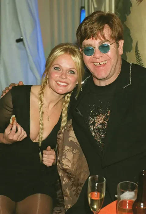Framed Print : Geri Halliwell and Elton John October 1999 at the premiere of the Lion King