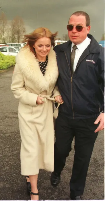 Framed Print : Geri Halliwell Ginger Spice in fur trimmed coat walks to the helicopter as she prepares