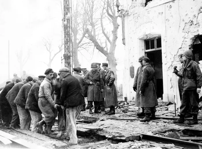 Framed Print : German American and French officers watch workmen replace the railway lines so that Framed Print : German American and French officers watch workmen replace the railway lines so that